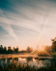 Sunrise over pond with mist and sunbeams in Kõrveküla, Tartu, Estonia (Kõrveküla tiik Tartus, päikesekiired ja kerge udu hommikul)