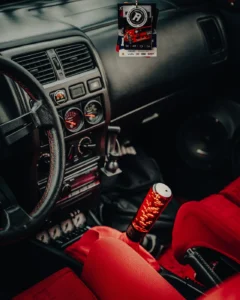 Car interior dashboard with gauges and red safety belt at Augustfest 2025 (Racing-stiilis salong, detailid esil)