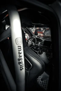 Sports steering wheel close-up in tuned car at Augustfest 2025 (Detailportree, rõhutab auto salongi)